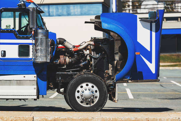 Broken down semi truck in a parking lot.