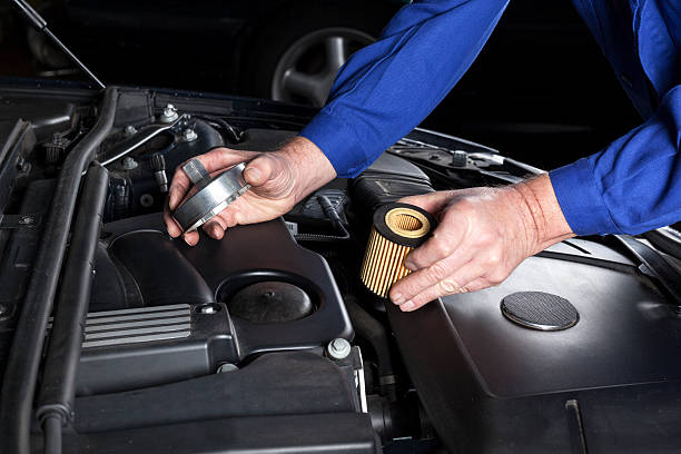 Mechanic is preparing an oilfilter change at a modern car engine