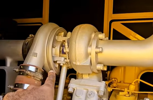 A close-up of a diesel generator’s turbocharger (a key part of the air intake system)—malfunctions here can cause poor combustion, so inspecting it is critical to stop the diesel generator blowing black smoke.